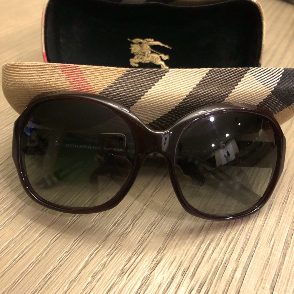 Burgundy Burberry sunglasses.